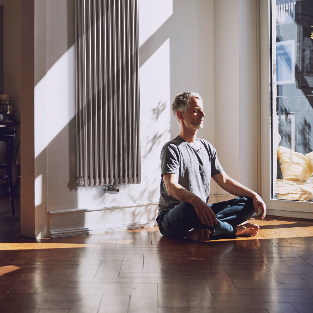 man meditates, old building flat, relaxed, charleston